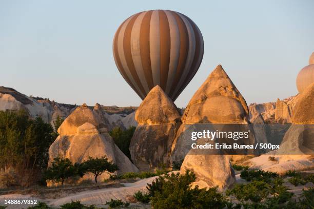 cappadocia,turkey the greatest tourist attraction of cappadocia,the flight with the balloon at sunrise,romania - cave fire stock pictures, royalty-free photos & images