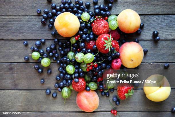 fresh berries on the table,top view,food closeup,romania - food photography dark background blue stock pictures, royalty-free photos & images