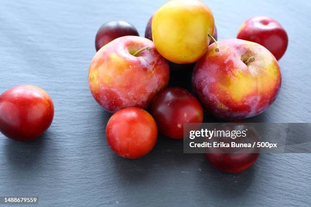 fresh fruit on slate background,food closeup,romania - red plum stock pictures, royalty-free photos & images