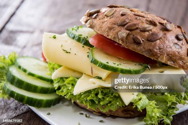 fresh made cheese sandwich on wooden background,romania - boterham met kaas stockfoto's en -beelden
