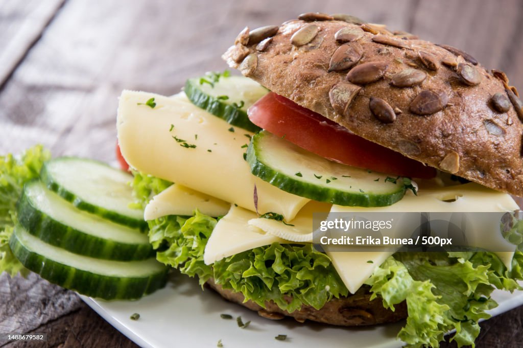 Fresh made Cheese Sandwich on wooden background,Romania