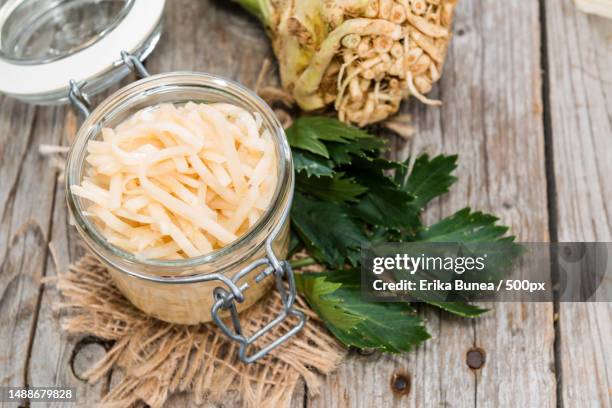 portion of homemade celeriac salad in a bowl close-up shot,romania - celeriac stockfoto's en -beelden