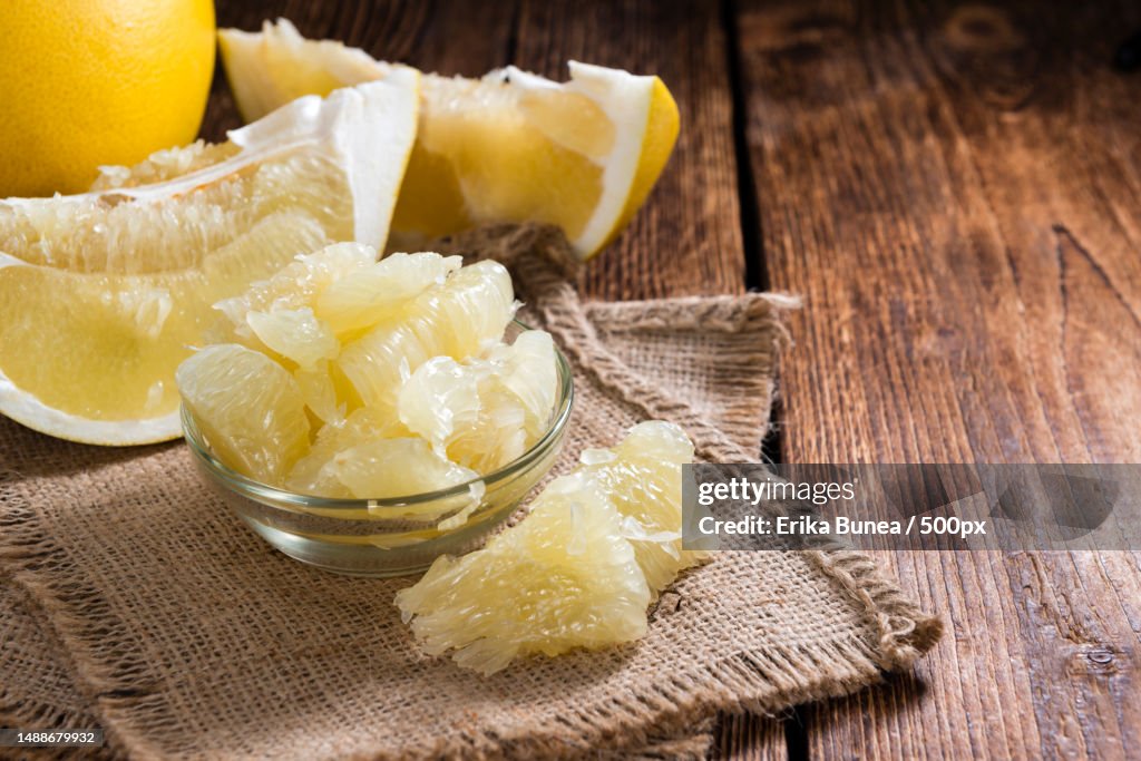 Fresh Pomelo close-up shot on vintage wooden background,Romania