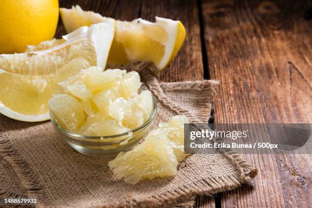 fresh pomelo close-up shot on vintage wooden background,romania - pomelo imagens e fotografias de stock