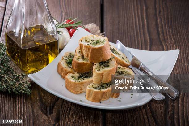 portion of garlic bread on wooden background,romania - garlic bread stock pictures, royalty-free photos & images