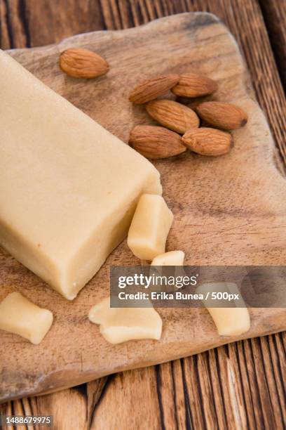 raw marzipan close-up shot on vintage wooden background,romania - marzipan stock-fotos und bilder