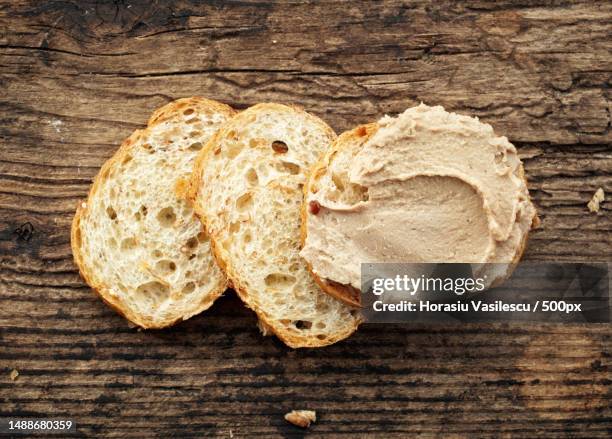 bread with liver pate on old wooden table - pate foto e immagini stock