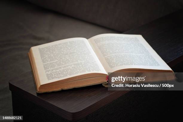 open old book closeup vignetting top view - open bible on table stock pictures, royalty-free photos & images