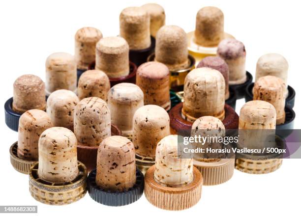 used corks from strong drinks isolated on white background,romania - weinkorken stock-fotos und bilder