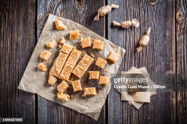 packed in paper sweet candies with sesame - fudge stock pictures, royalty-free photos & images