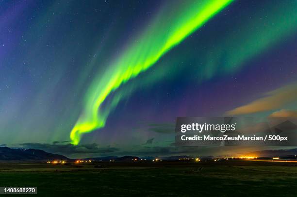 scenic view of illuminated landscape against sky at night - boreal forest stock pictures, royalty-free photos & images