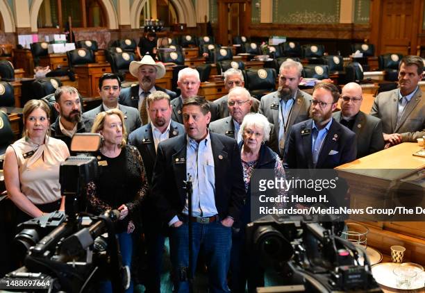 Colorado Representative Mike Lynch, center, surrounded by other Republican members of the House, speaks during a press conference in the House...