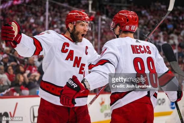 Martin Necas of the Carolina Hurricanes celebrates with teammates after scoring a goal during the second period against the New Jersey Devils in Game...