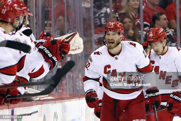Brett Pesce of the Carolina Hurricanes celebrates his second period goal against the New Jersey Devils in Game Four of the Second Round of the 2023...