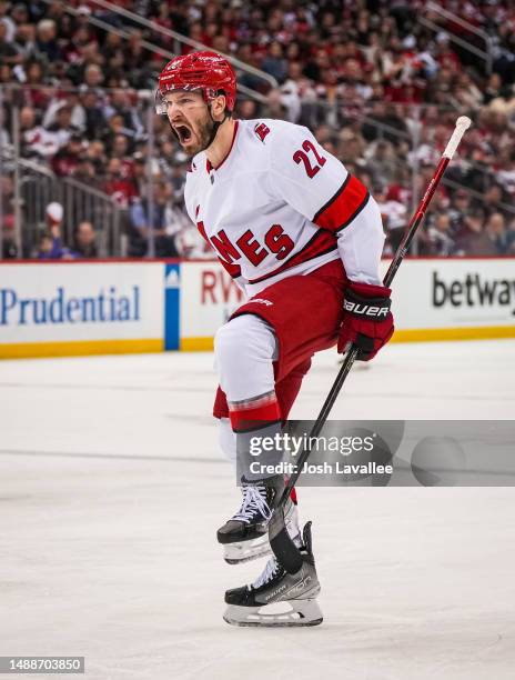 Brett Pesce of the Carolina Hurricanes celebrates after scoring a goal during the second period against the New Jersey Devils in Game Four of the...