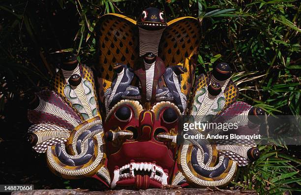 traditional " nadagam " dance mask from ambalangoda, performers, mostly male wear some grotesque and deformed mask when performing traditional dances, the best known is " kolam " ( kolam is tamil for costume or guise ) - kolam mask stock pictures, royalty-free photos & images