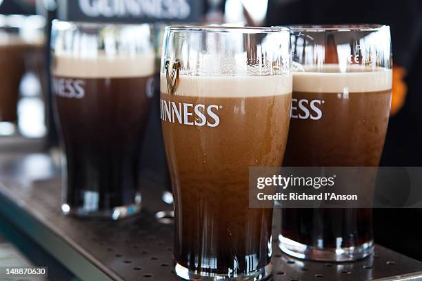 pints of guinness at gravity bar at guinness storehouse. - guinness stock pictures, royalty-free photos & images
