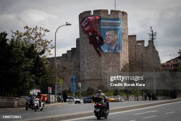 Poster bearing a portrait of Turkey's President Recep Tayyip Erdogan is displayed on ancient city walls on May 09, 2023 in Istanbul, Turkey. On May...