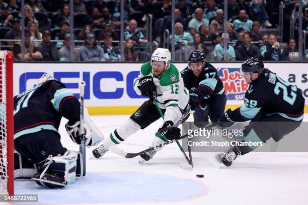 Vince Dunn of the Seattle Kraken breaks the stick of Radek Faksa of the Dallas Stars during the first period in Game Four of the Second Round of the...