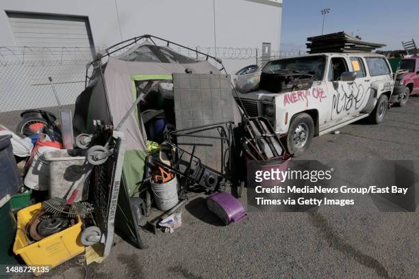 Tent and several tagged vehicles are seen at the former Wood Street homeless encampment in Oakland, Calif., on Monday, May 8, 2023. The city recently...