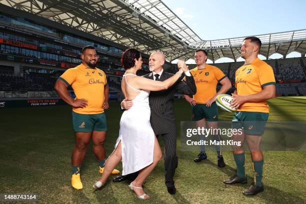 Taniela Tupou, Angus Bell and David Porecki of the Wallabies pose alongside Argentinian tango dancers Karina and Fabian during a Wallabies media...