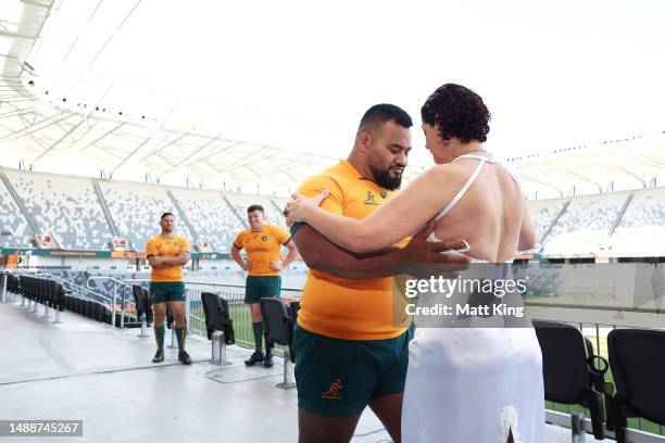 Taniela Tupou of the Wallabies dances with Argentinian tango dancers Karina and Fabian as David Porecki and Angus Bell of the Wallabies look on...