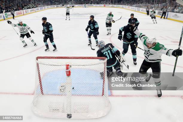 Roope Hintz celebrates a goal by Jamie Benn of the Dallas Stars during the first period against the Seattle Kraken in Game Four of the Second Round...