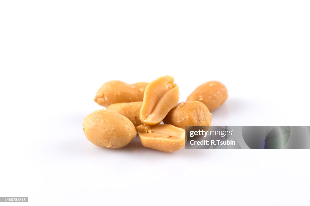 Peanut nuts salt in heap isolated on white background