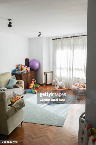 a living room full of toys - messy living room stock pictures, royalty-free photos & images