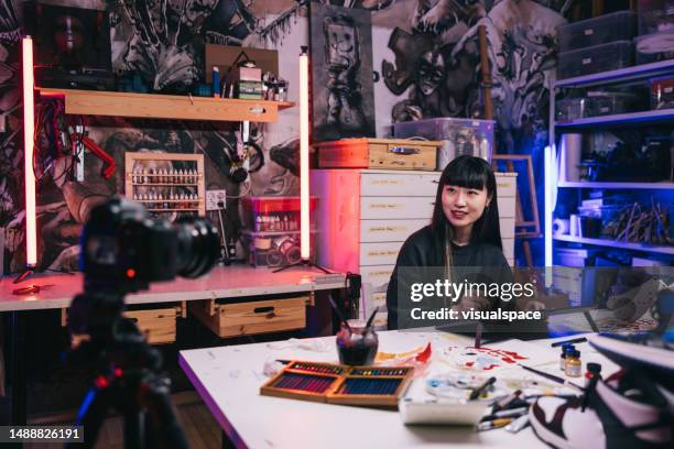 japanese sneaker artist making a tutorial video in her studio - art studio stock pictures, royalty-free photos & images