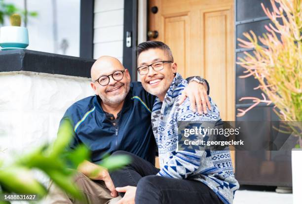 portrait of couple happy at home - casal gay imagens e fotografias de stock