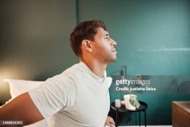 wake up, bedroom and relax man stretching for morning wellness, start of new day and calm after fatigue rest. healthy sleep energy, mental health peace or profile person rise after dream in hotel bed - new content stock pictures, royalty-free photos & images