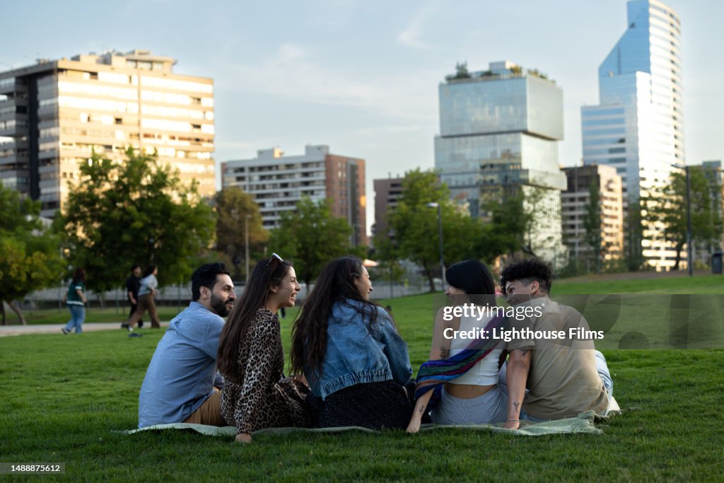 A group of five friends prepare to watch the sunset over the city