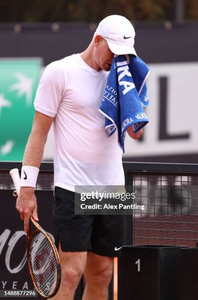 Kyle Edmund of Great Britain wipes his face with a towel in his round of 128 match against Alexandre Muller of France at Foro Italico on May 10, 2023...