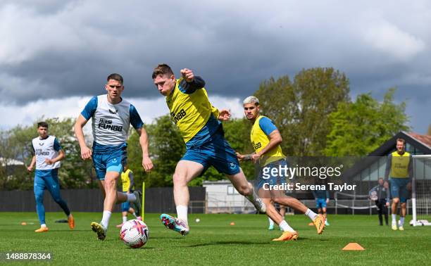 Elliot Anderson controls the ball during the Newcastle United Training Session at the Newcastle United Training Centre on May 10, 2023 in Newcastle...