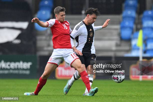 Aaron Zehnter of Germany competes for the ball with Filip Bundgaard of Denmark during the U19 Denmark and U19 Germany International Friendly match at...