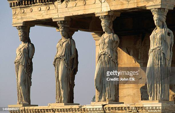 the famous caryatids have been supporting the southern portico of the erechtheion in the acropolis since 407 b.c. - cariátide fotografías e imágenes de stock