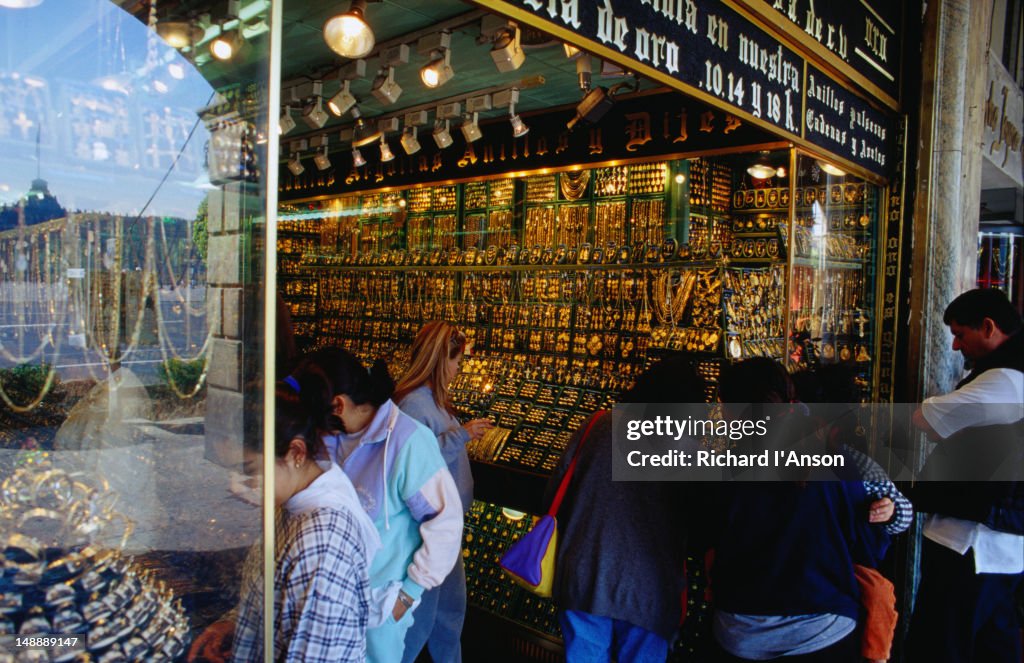 Shopping for gold on the Zocalo, Mexico City's huge square, the Zocalo is dominated on the west side by shop after shop of gold and silver jewellery
