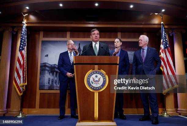 Sen. Mark Warner joined by Sen. Jerry Moran , Sen. Ron Wyden and Sen. John Cornyn speaks on security classification reform at the U.S. Capitol on May...