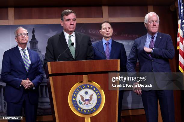 Sen. Mark Warner joined by Sen. Jerry Moran , Sen. Ron Wyden and Sen. John Cornyn speaks on security classification reform at the U.S. Capitol on May...