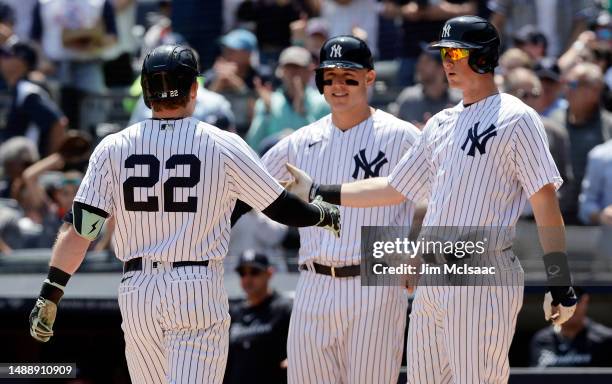 Harrison Bader of the New York Yankees celebrates his first inning three run home run against the Oakland Athletics with teammate Anthony Rizzo and...