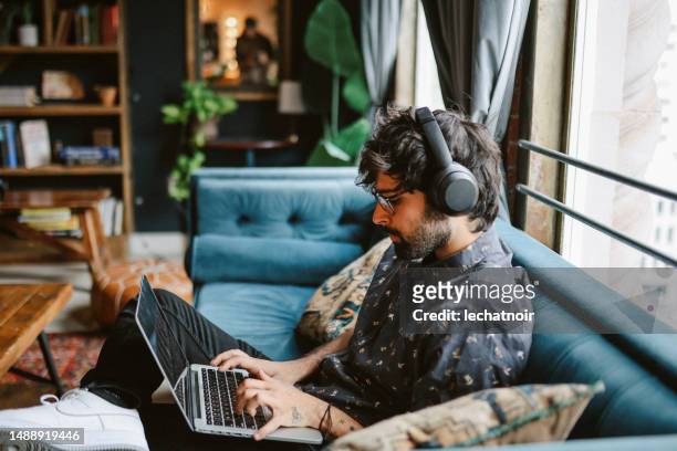 working from home in downtown los angeles - man working from home stock pictures, royalty-free photos & images