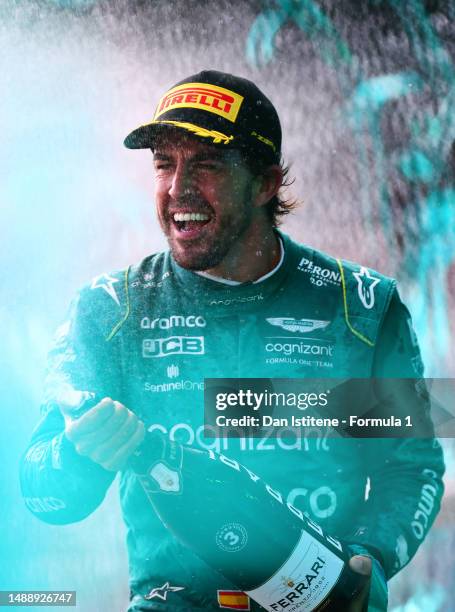 Third placed Fernando Alonso of Spain and Aston Martin F1 Team celebrates on the podium after the F1 Grand Prix of Miami at Miami International...