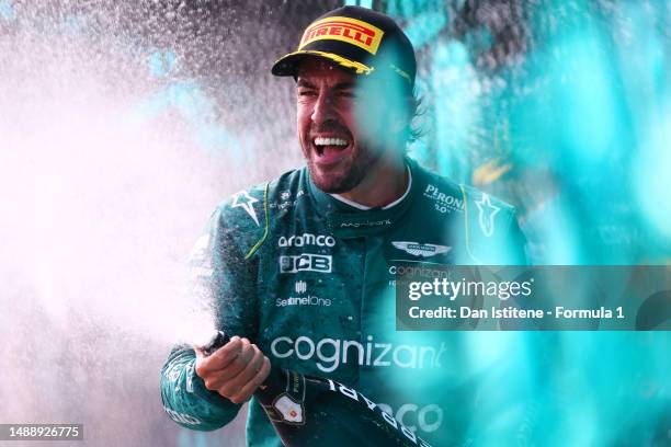 Third placed Fernando Alonso of Spain and Aston Martin F1 Team celebrates on the podium after the F1 Grand Prix of Miami at Miami International...