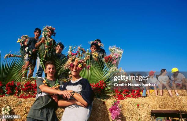 people enjoy the shavuot celebrations, kibbutz ein shemer near haifa. - shavuot stock pictures, royalty-free photos & images