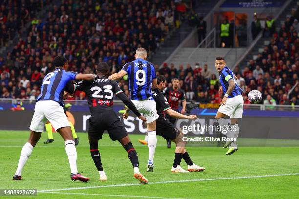 Edin Dzeko of FC Internazionale scores the team's first goal during the UEFA Champions League semi-final first leg match between AC Milan and FC...