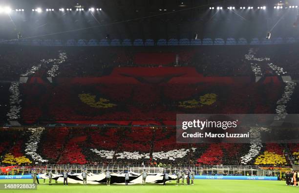 General view of the inside of the stadium as fans of AC Milan form a TIFO in the shape of a Devil prior to the UEFA Champions League semi-final first...