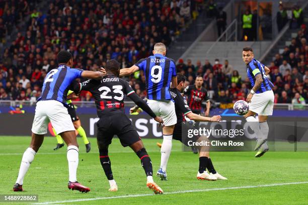 Edin Dzeko of FC Internazionale scores the team's first goal during the UEFA Champions League semi-final first leg match between AC Milan and FC...
