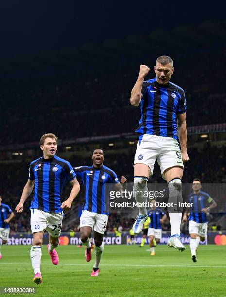 Edin Dzeko celebrates with Nicolo Barella after scoring their team's first goal during the UEFA Champions League semi-final first leg match between...