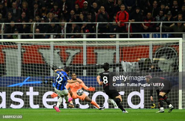 Henrikh Mkhitaryan of FC Internazionale scores the team's second goal as Mike Maignan of AC Milan fails to make a save during the UEFA Champions...